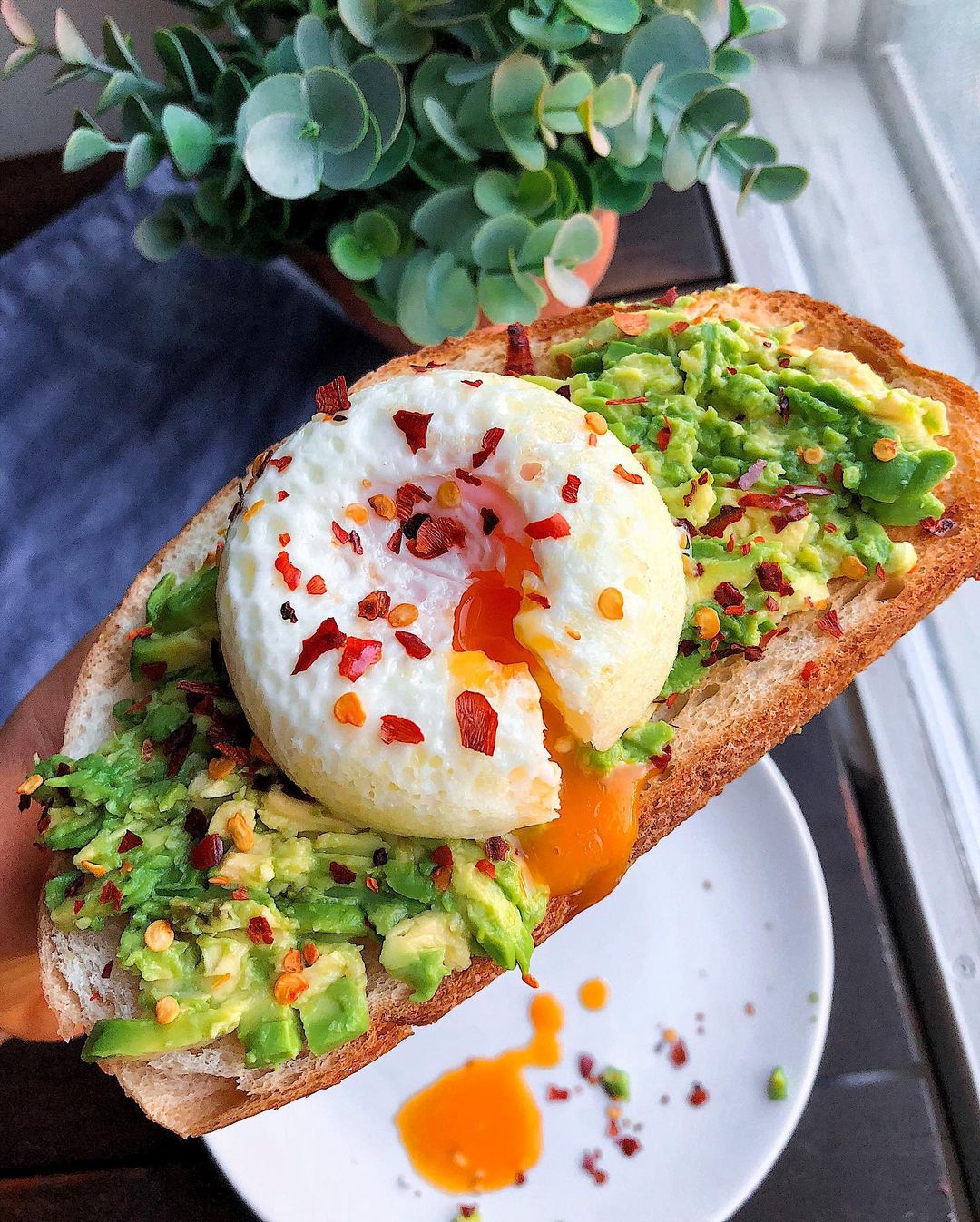 Poached Egg Avocado Toast with Red Pepper Flakes