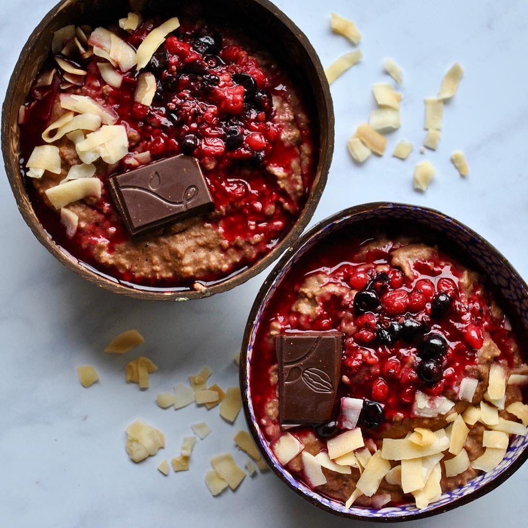 Creamy Chocolate Porridge with Berry Compote and Toasted Coconut