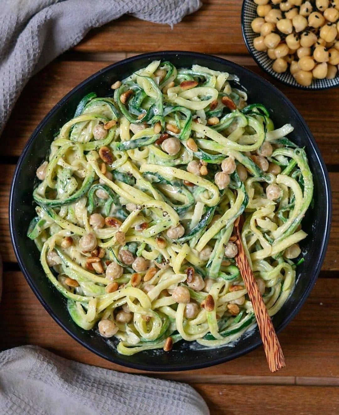 Creamy Tahini Garlic Sauce with Zucchini Noodles, Chickpeas, and Pine Nuts