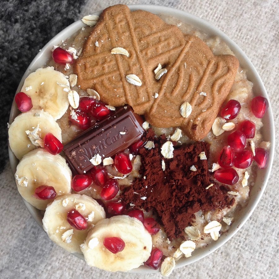 Oatmeal Bowl with Bananas, Pomegranate, Chocolate, and Cookies