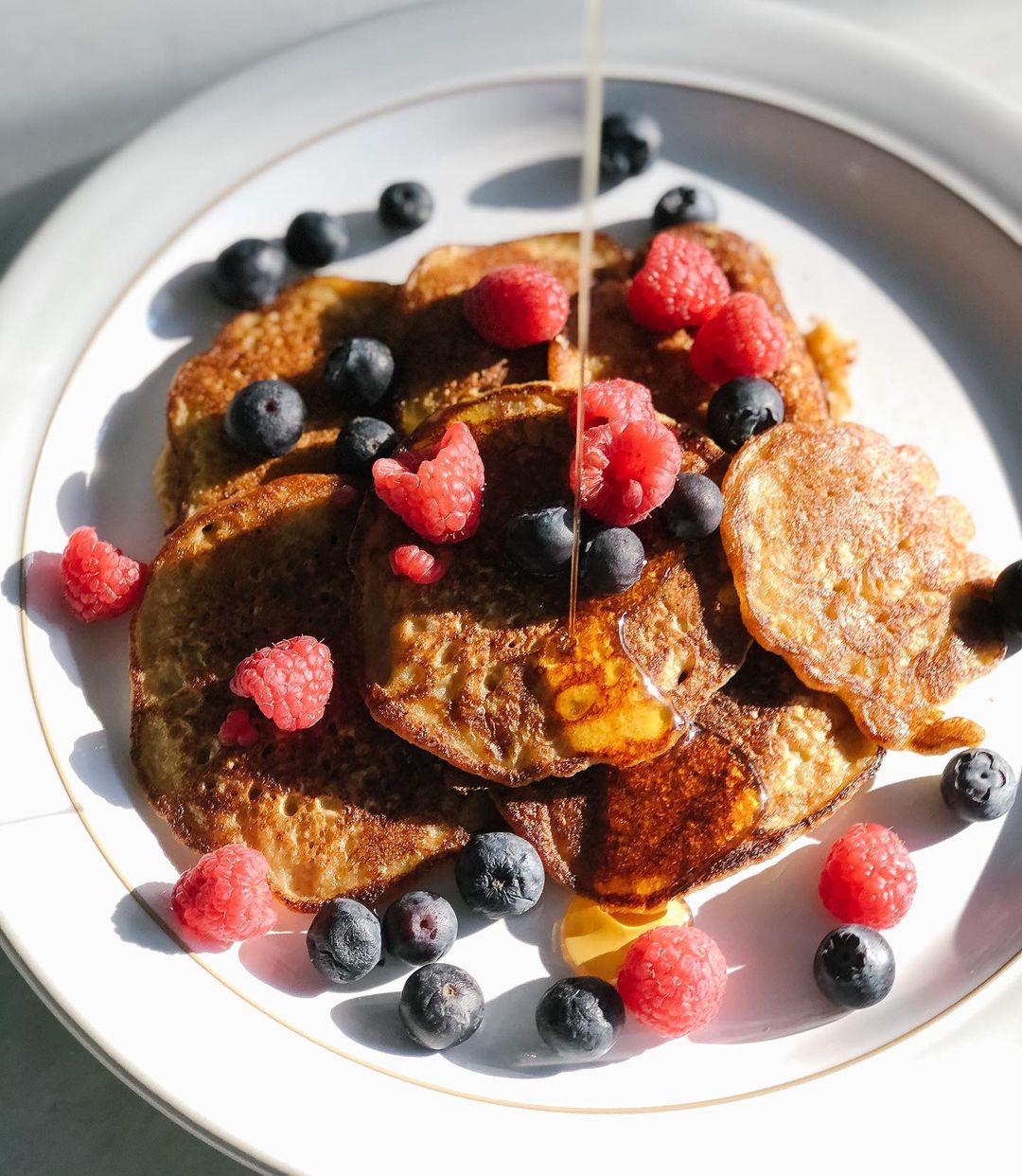 Oat Blender Pancakes with Berries and Maple Syrup
