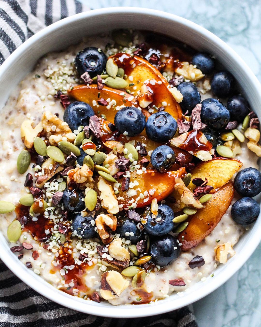 Cardamom Oats with Baked Peaches and Nutty Toppings