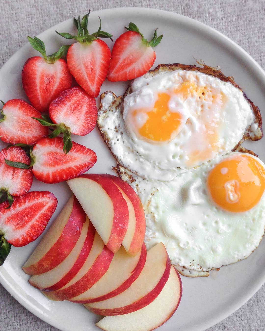 Simple Breakfast with Strawberries Apples and Eggs