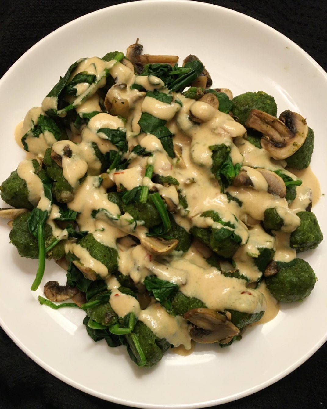 Kale Gnocchi with Mushrooms, Spinach, and Tahini Sauce